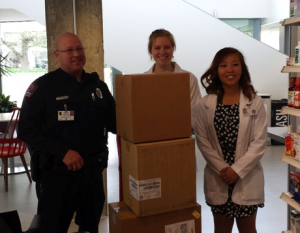 OSU Police Officer Dave Ferimer, and P3 Pharm.D. students Andrea Haugtvedt and Lena Wu with boxes of unneeded drugs for destruction at the conclusion of the latest event. Photo courtesy of Candace Haugtvedt.